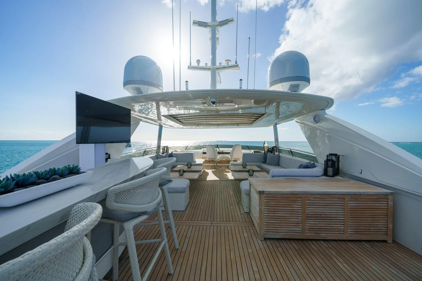 a deck with chairs and a boat on it aboard CURRENT $EA Yacht for Sale