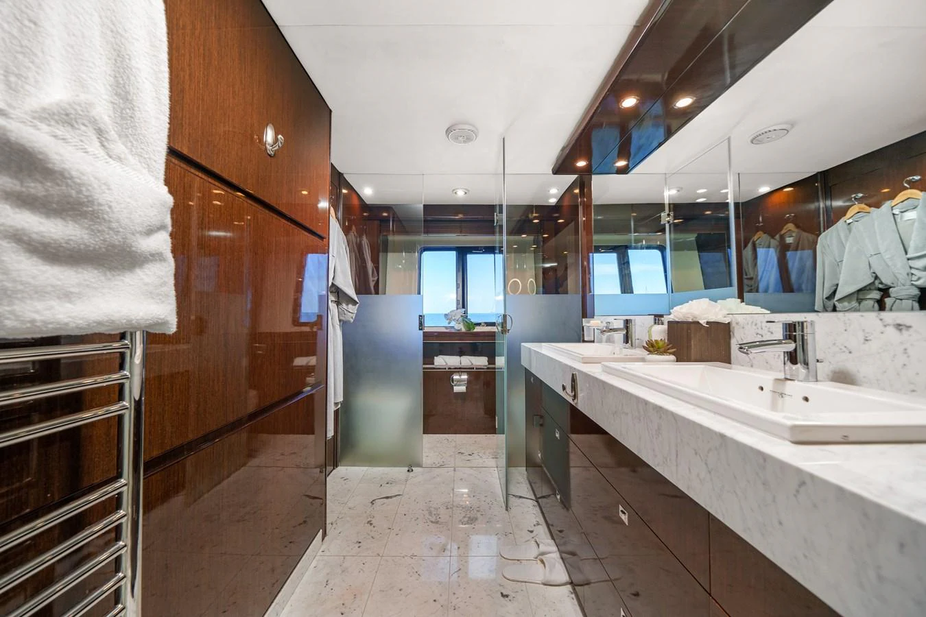 a bathroom with a countertop sink and a mirror aboard CURRENT $EA Yacht for Sale