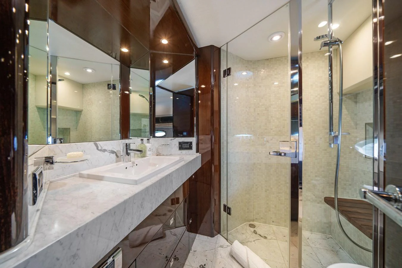a bathroom with a large mirror aboard CURRENT $EA Yacht for Sale