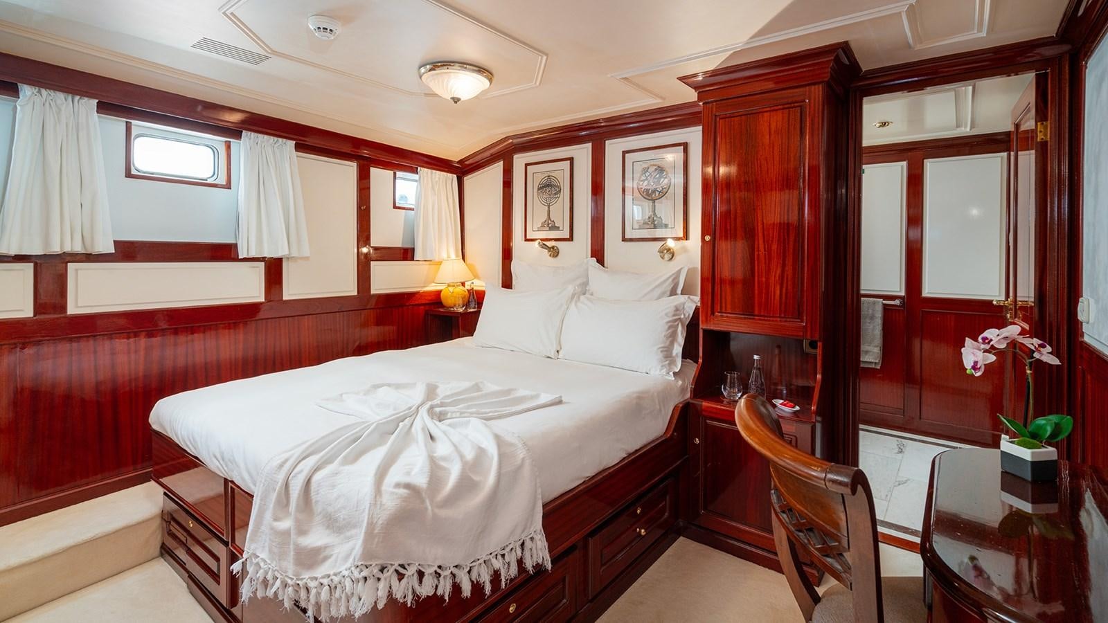 a room with a bed and a desk aboard SEA LION Yacht for Sale