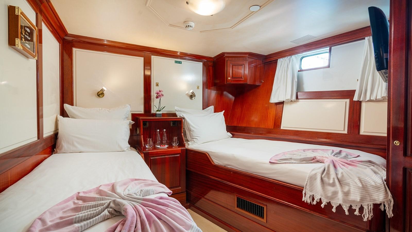 a room with two beds aboard SEA LION Yacht for Sale