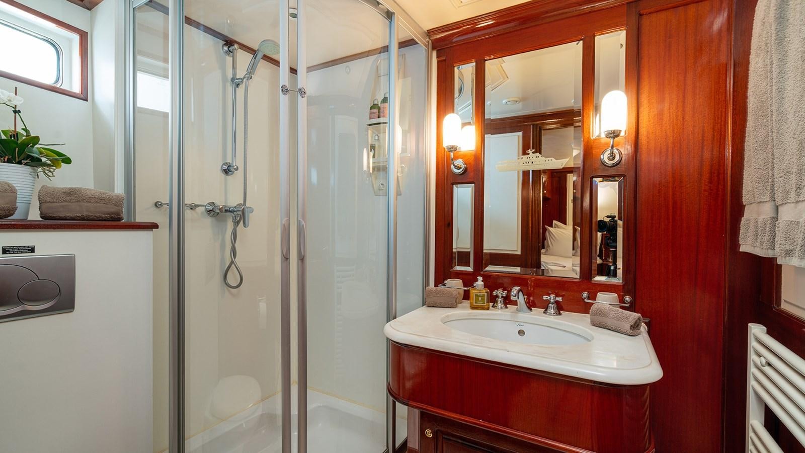 a bathroom with a glass shower aboard SEA LION Yacht for Sale
