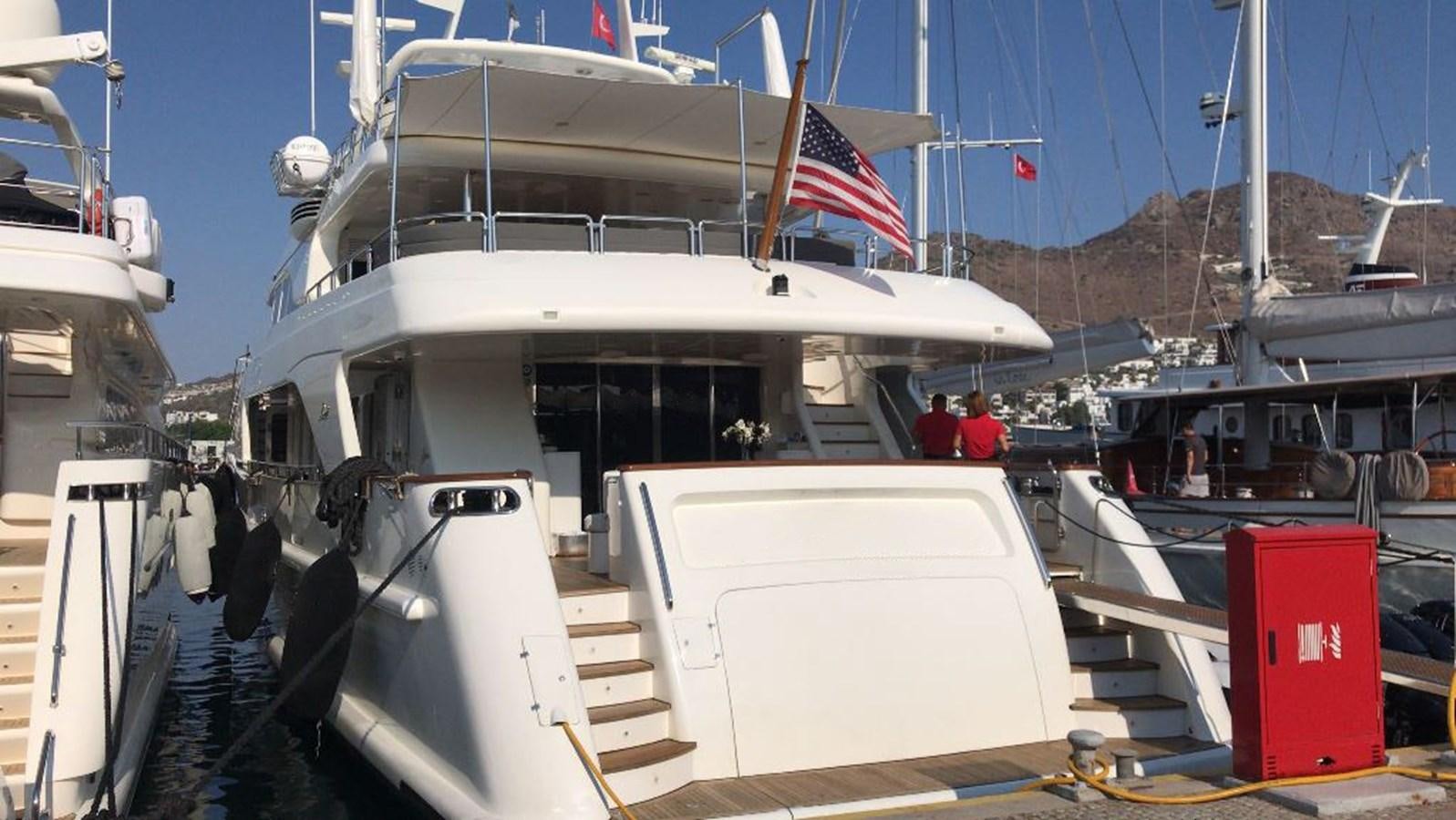 a boat docked at a pier aboard B-D Yacht for Sale
