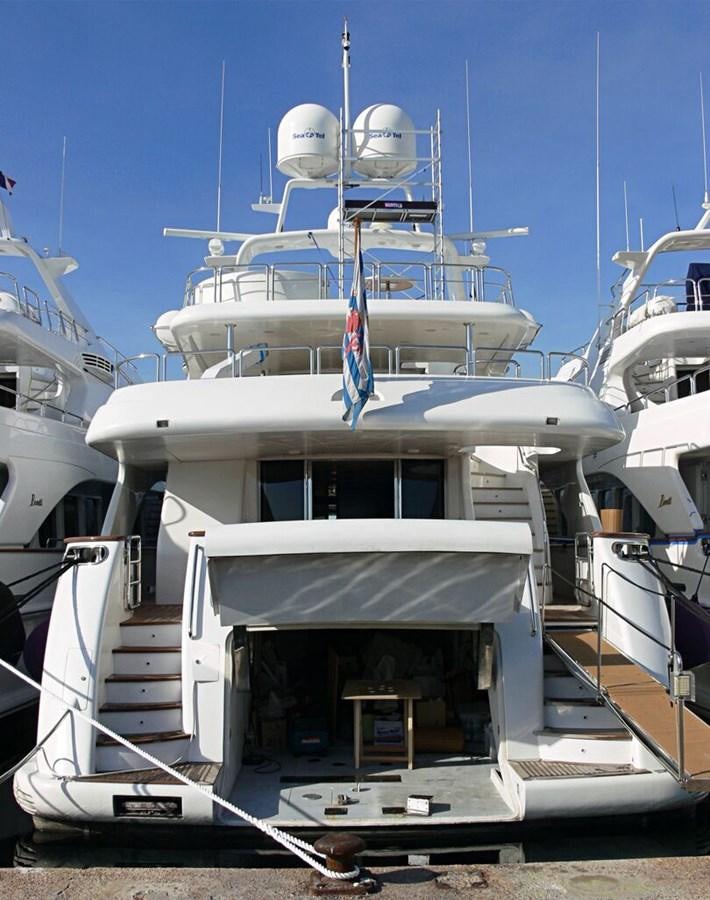 a large white boat with a satellite dish on top aboard B-D Yacht for Sale