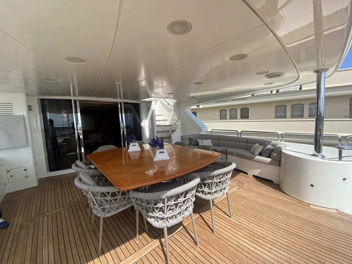 a room with a table and chairs aboard B-D Yacht for Sale