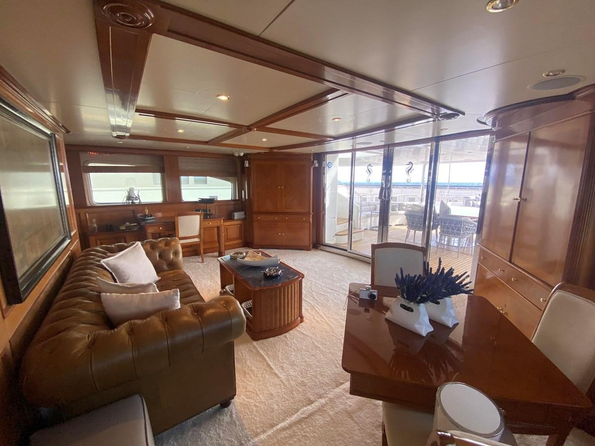 a living room with a large window aboard B-D Yacht for Sale