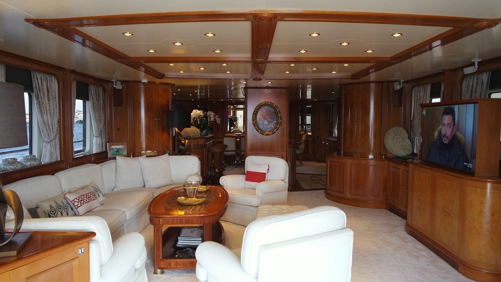 a living room with a large television aboard B-D Yacht for Sale