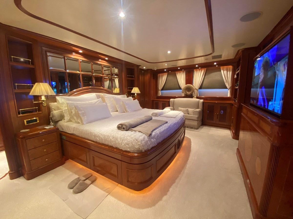 a bedroom with a large bed aboard B-D Yacht for Sale