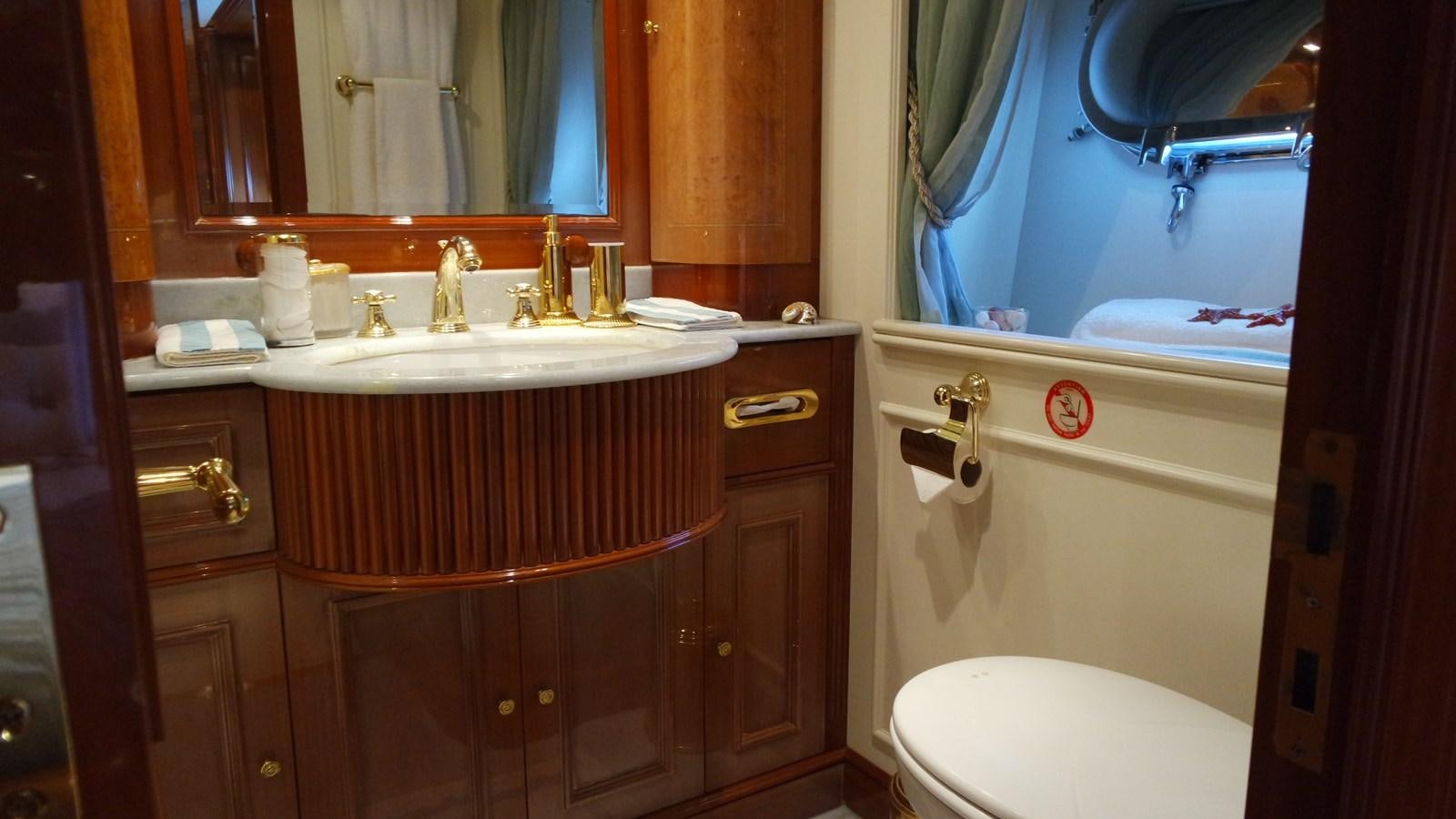 a bathroom with a sink and a toilet aboard B-D Yacht for Sale
