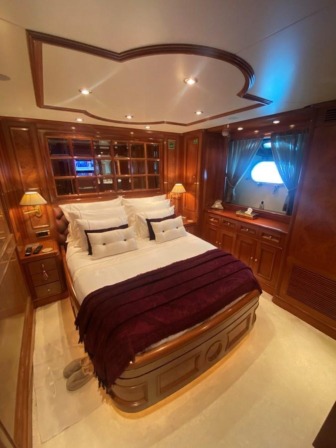 a bed in a room aboard B-D Yacht for Sale
