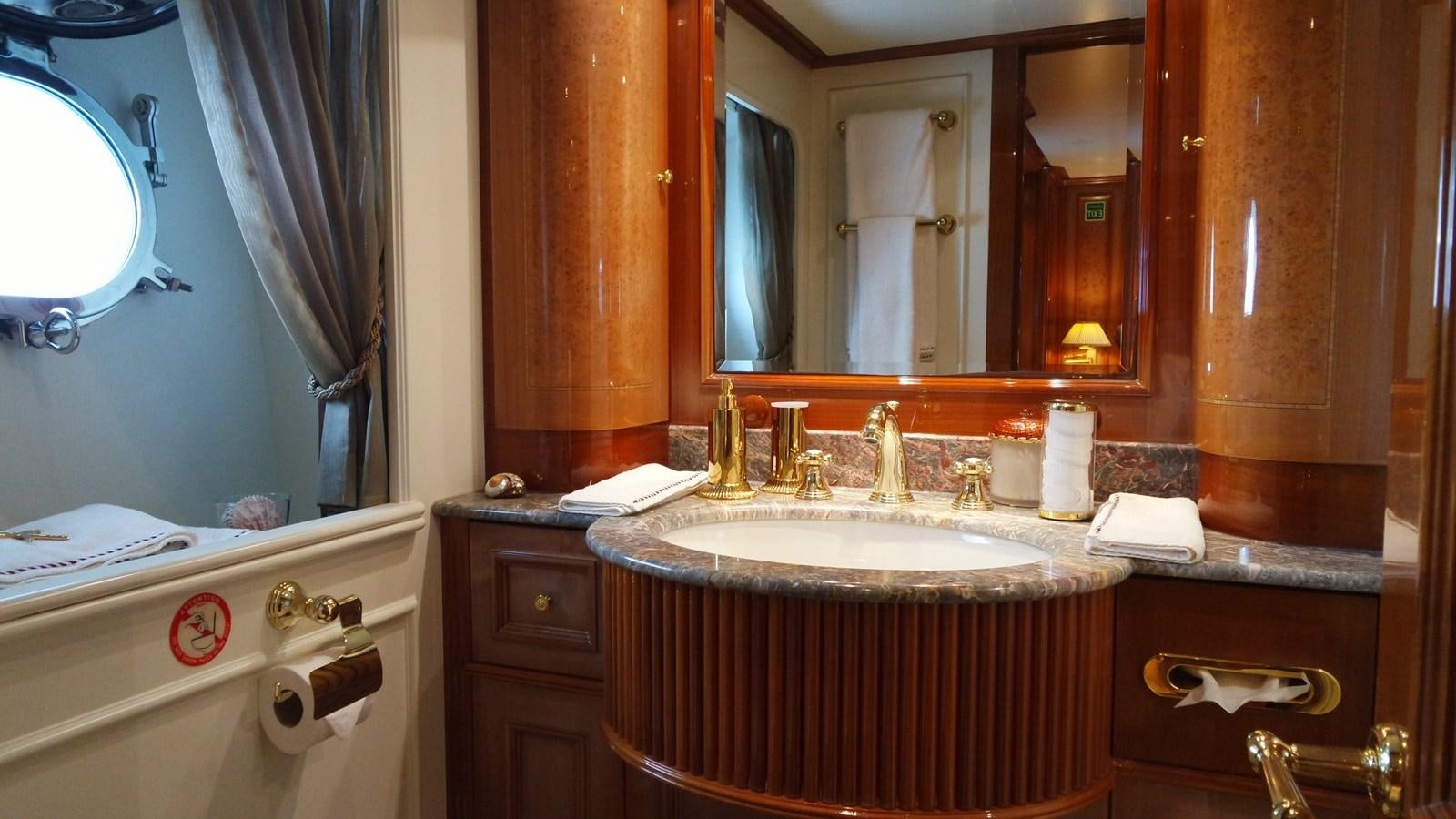 a bathroom with a large mirror aboard B-D Yacht for Sale