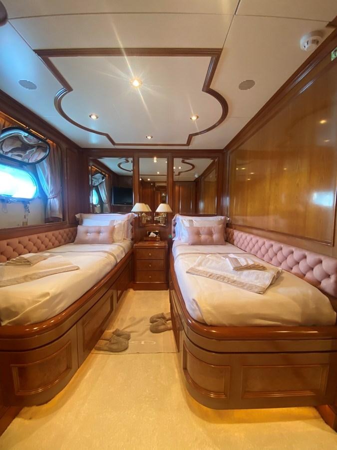 a room with a couple of beds aboard B-D Yacht for Sale