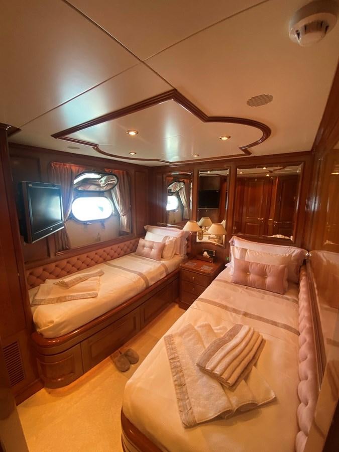 a room with a bed and a television aboard B-D Yacht for Sale