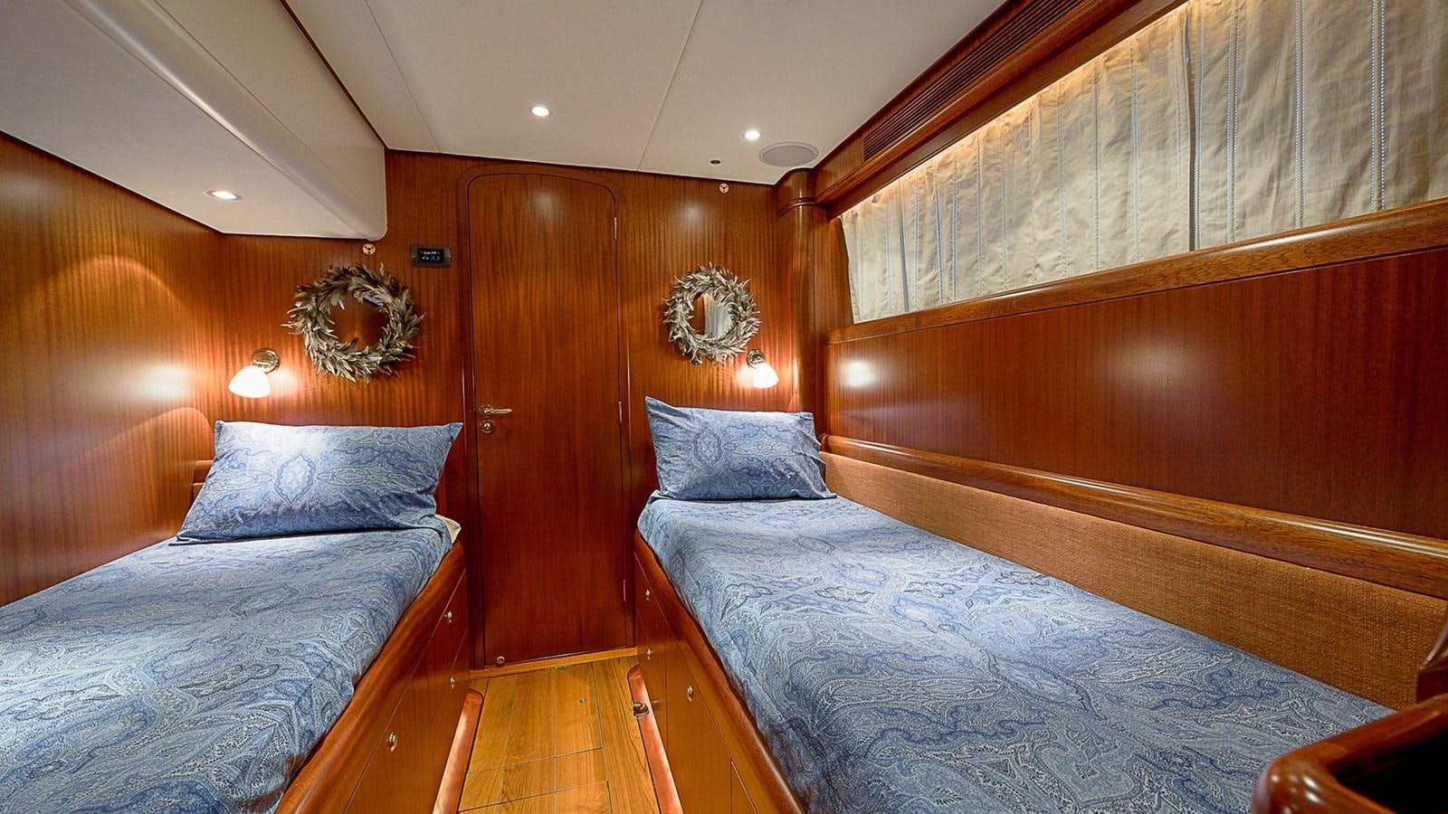 a room with two beds aboard GOOD TIMES Yacht for Sale