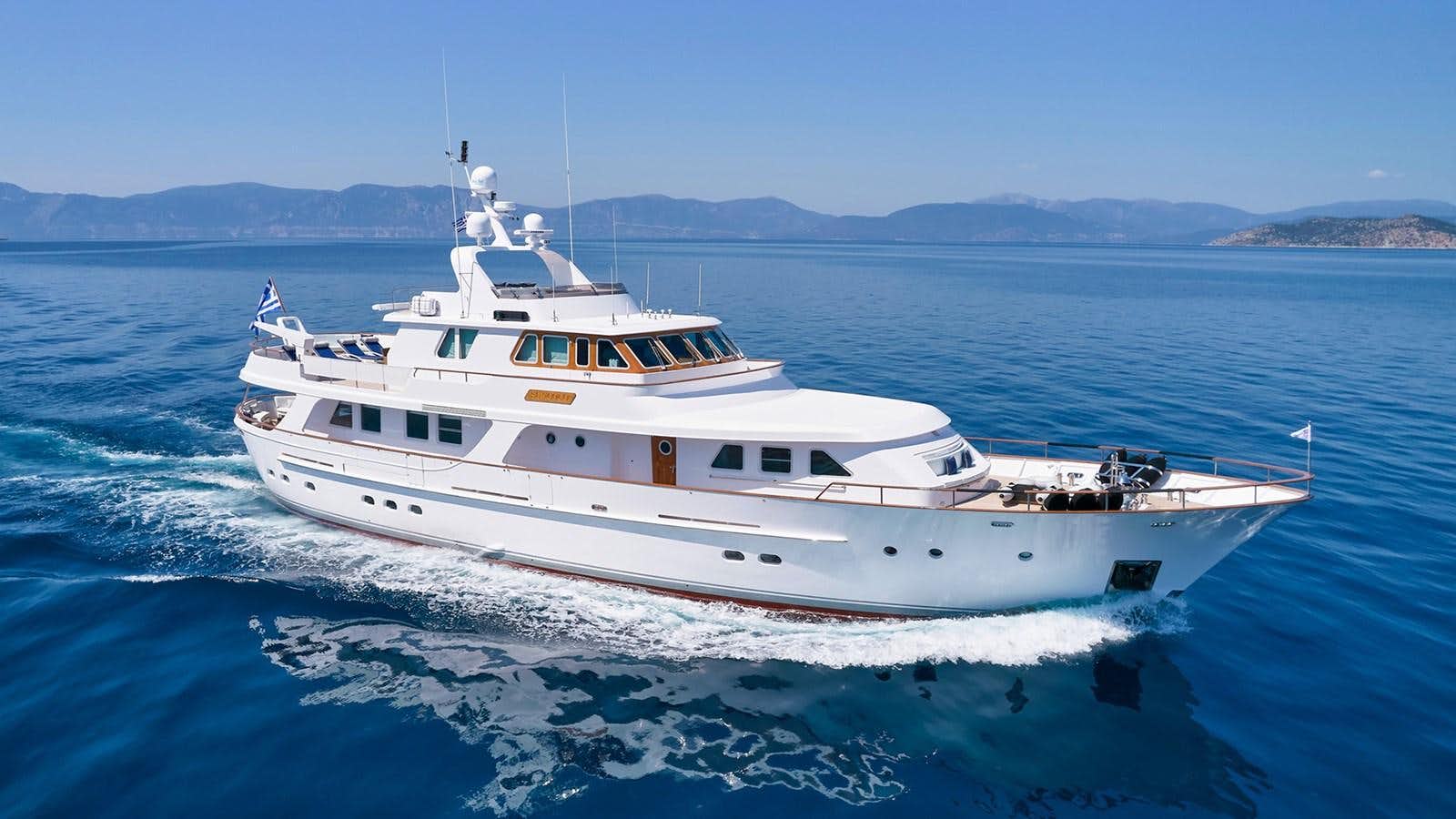 a white yacht on the water aboard SUNCOCO Yacht for Sale