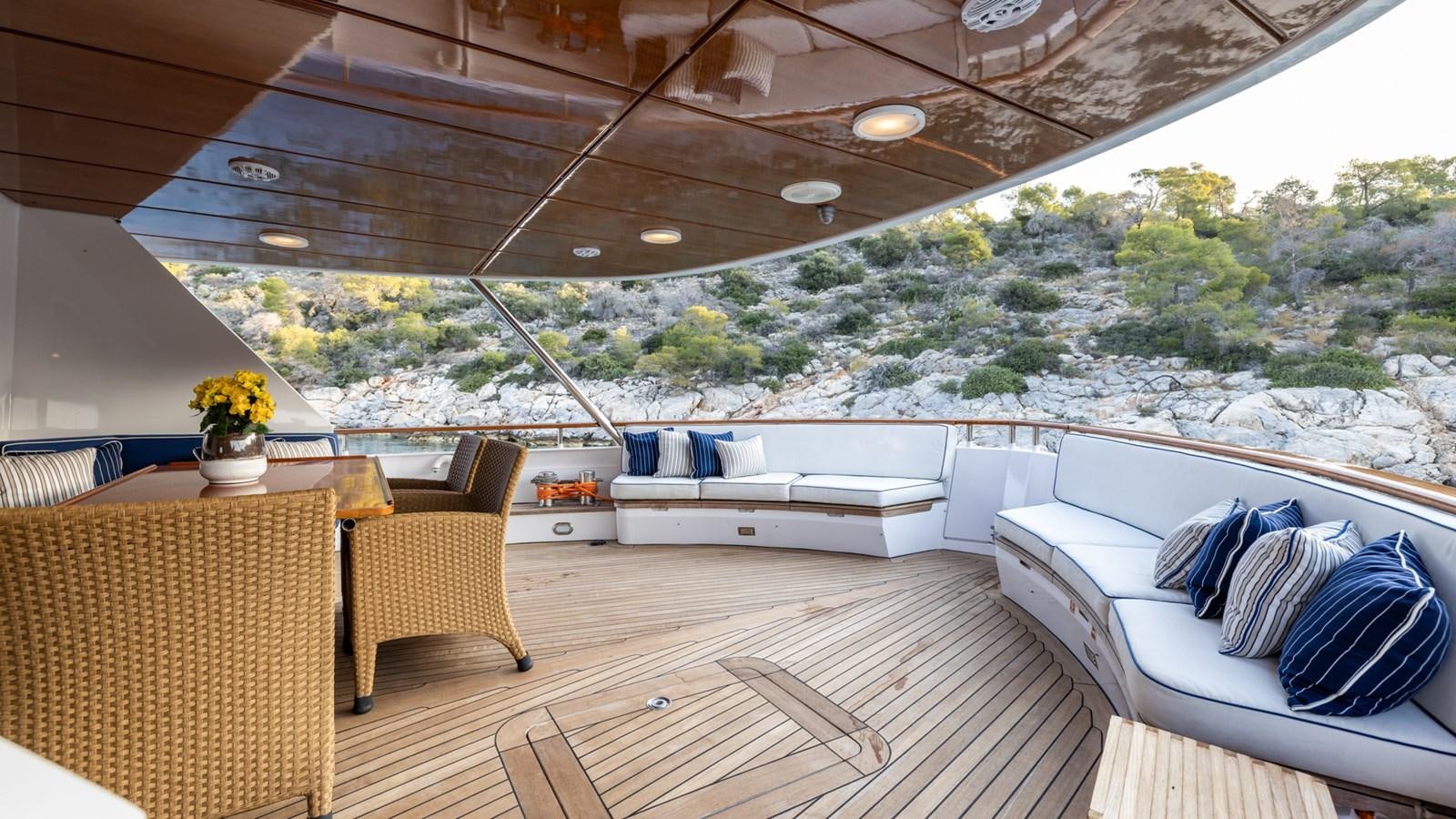 a room with a couch and a table and chairs aboard SUNCOCO Yacht for Sale