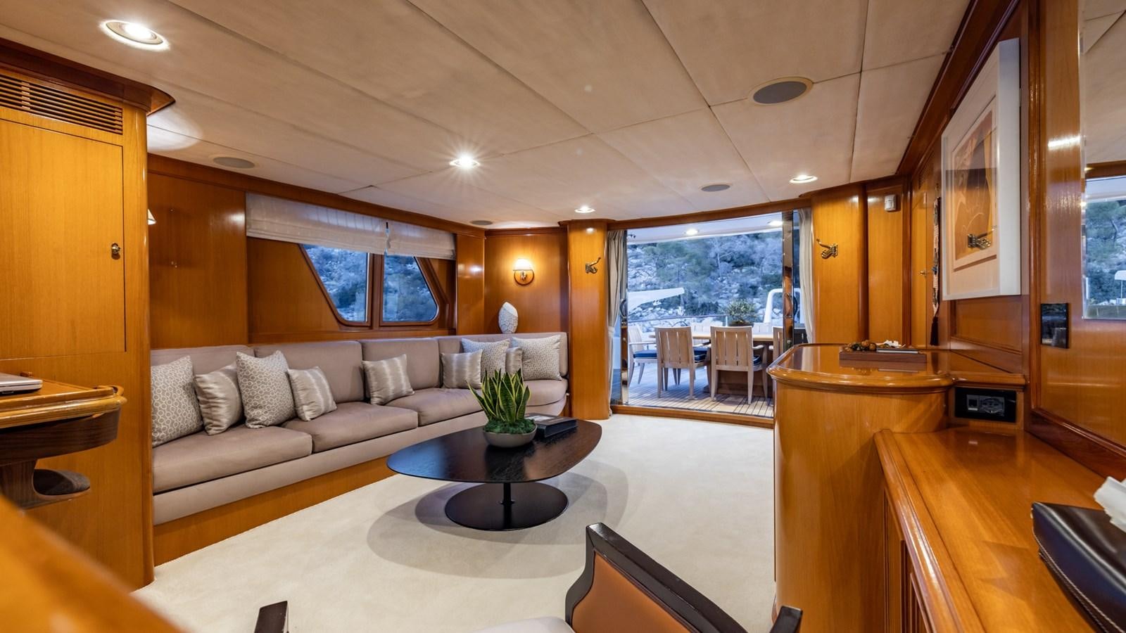 a living room with a couch and a coffee table aboard SUNCOCO Yacht for Sale