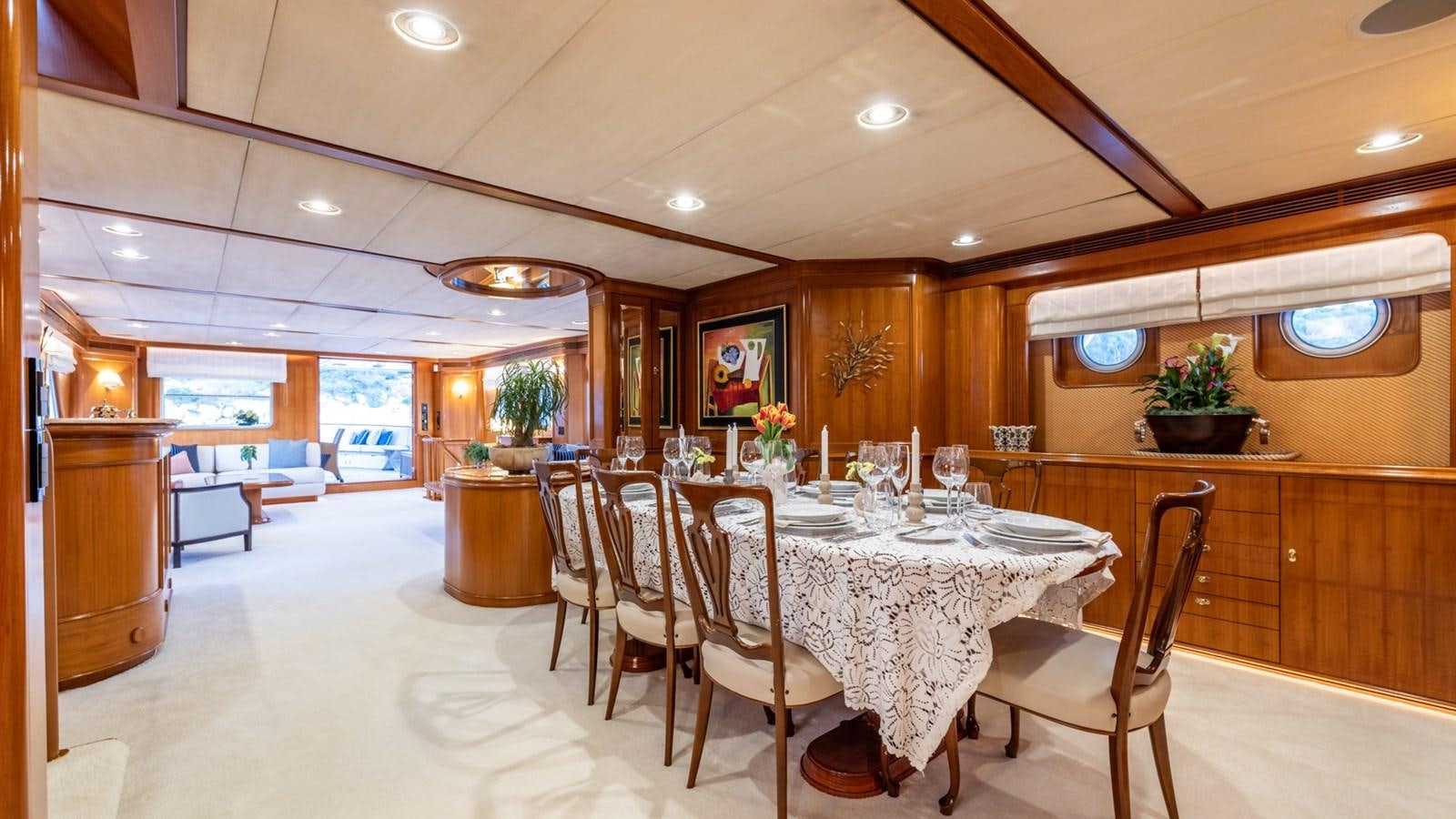 a dining room with a table and chairs aboard SUNCOCO Yacht for Sale