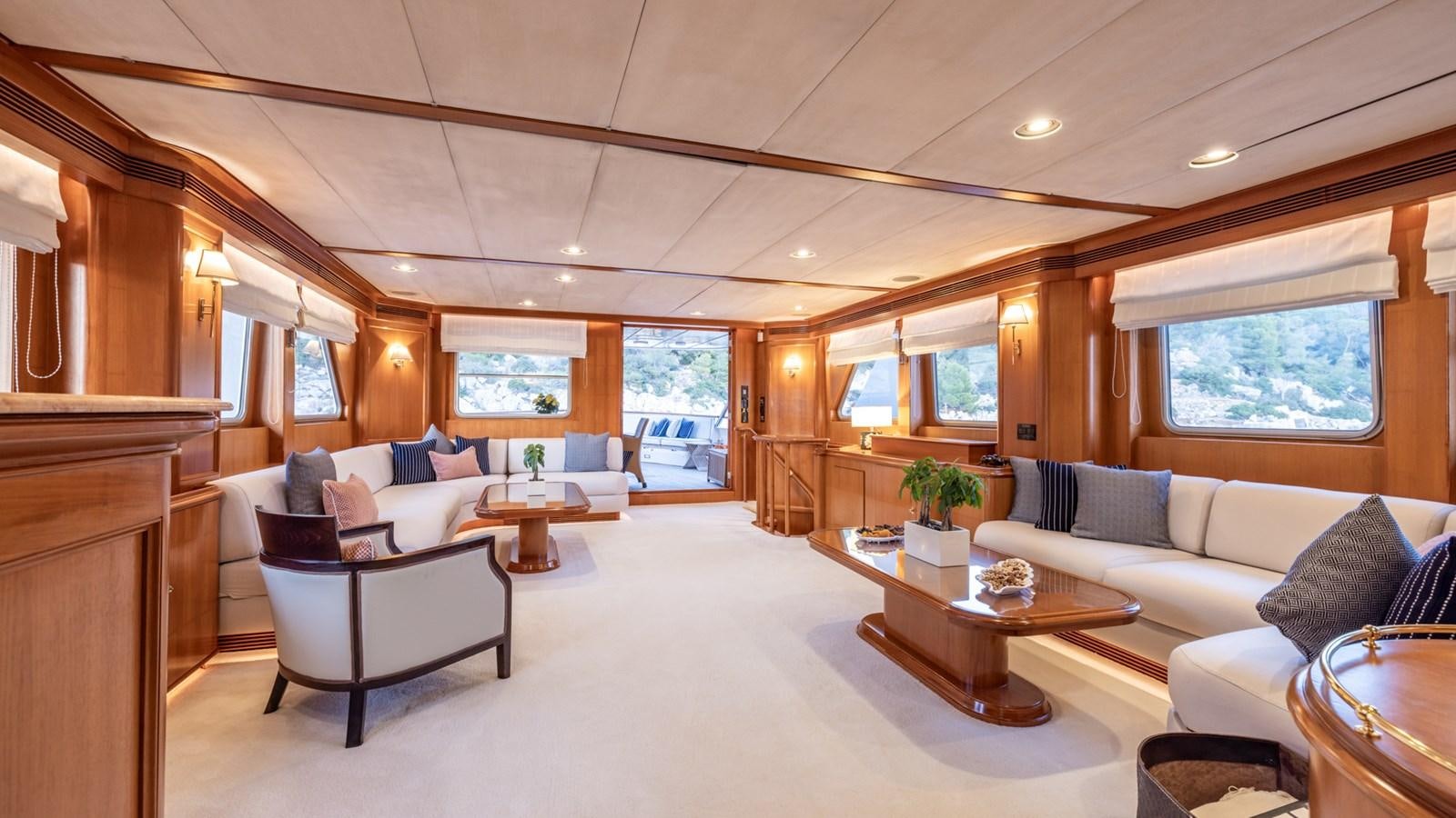 a living room with a couch and a table aboard SUNCOCO Yacht for Sale