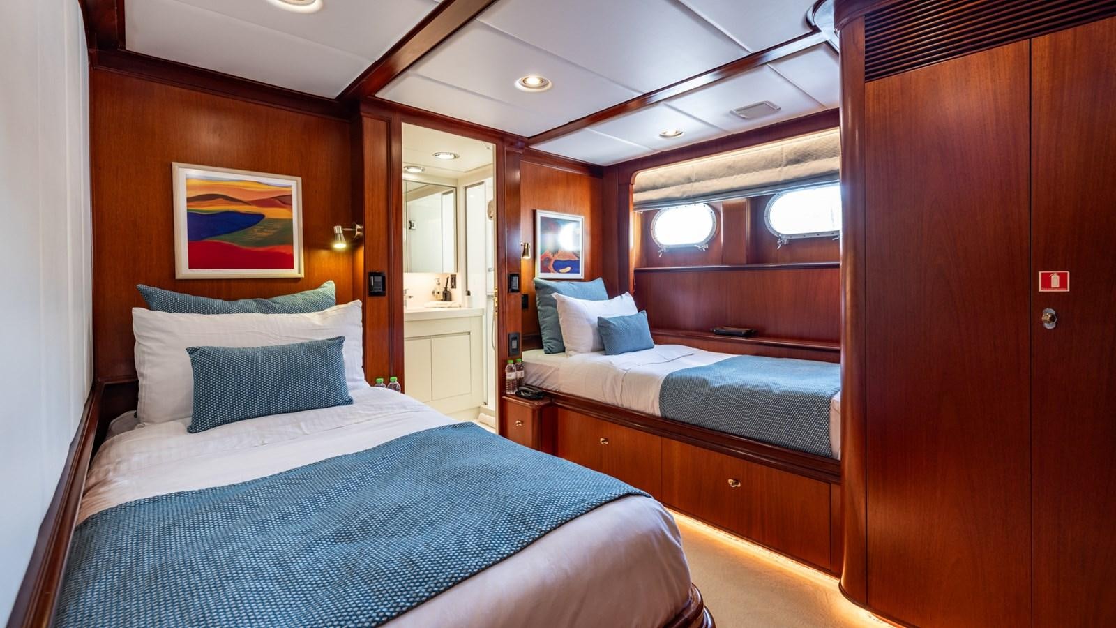 a room with two beds aboard SUNCOCO Yacht for Sale