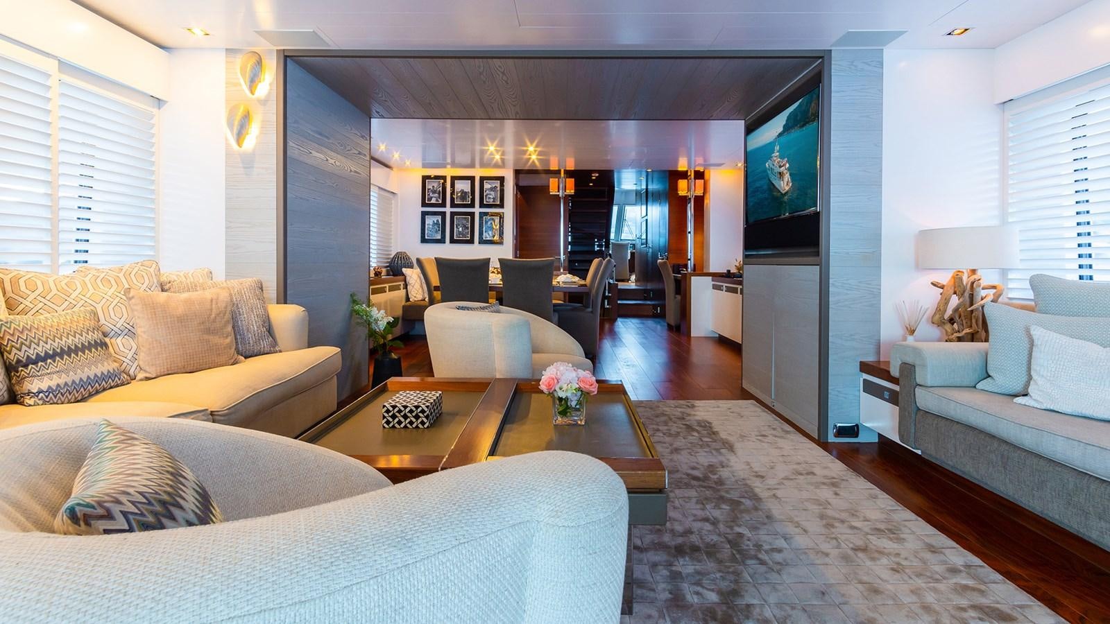 a living room with a large screen aboard HEERLIJCKHEID Yacht for Sale