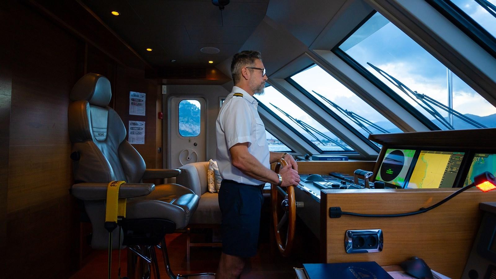 a man standing in a room aboard HEERLIJCKHEID Yacht for Sale
