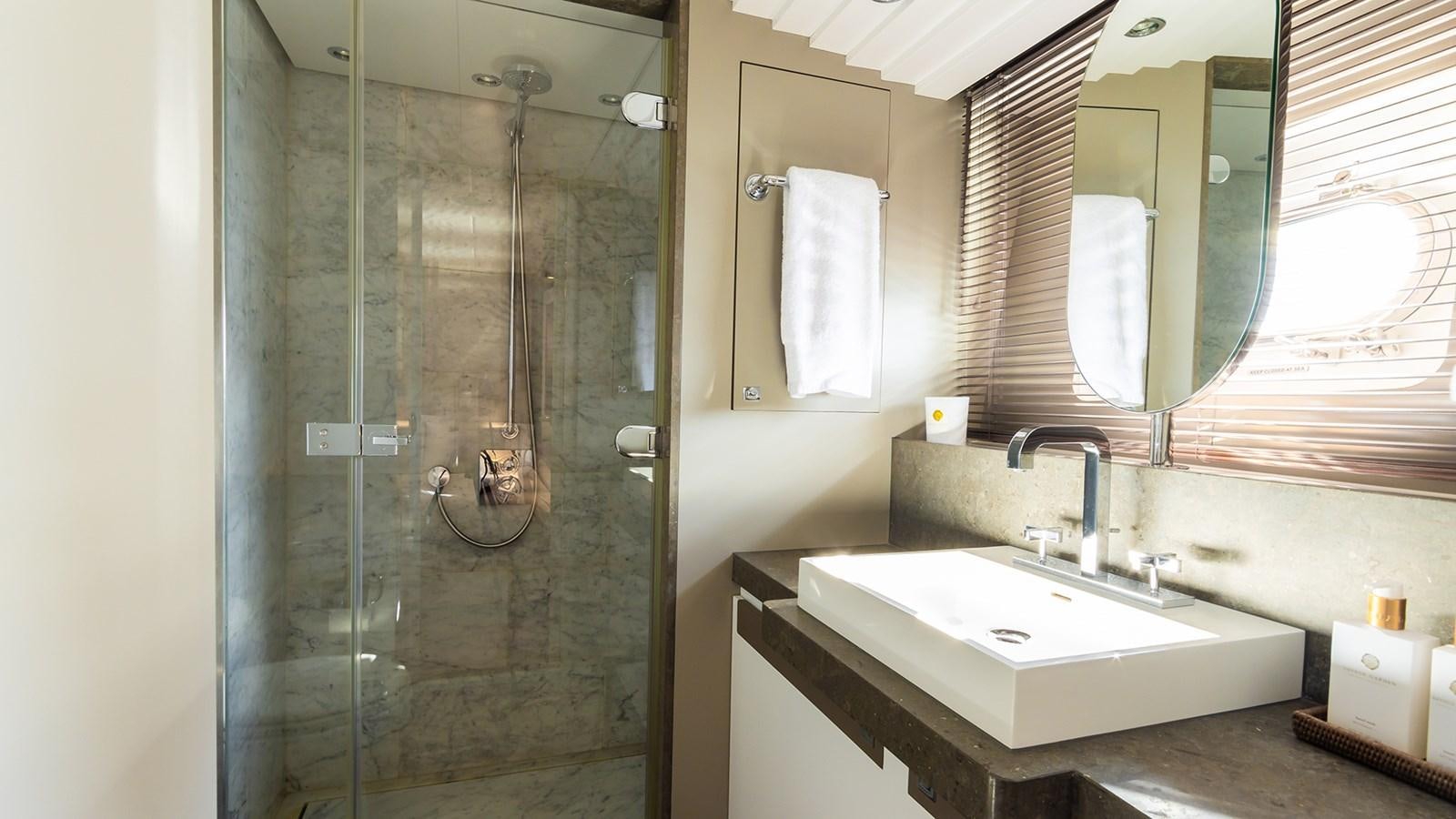 a bathroom with a shower unit and sink aboard HEERLIJCKHEID Yacht for Sale