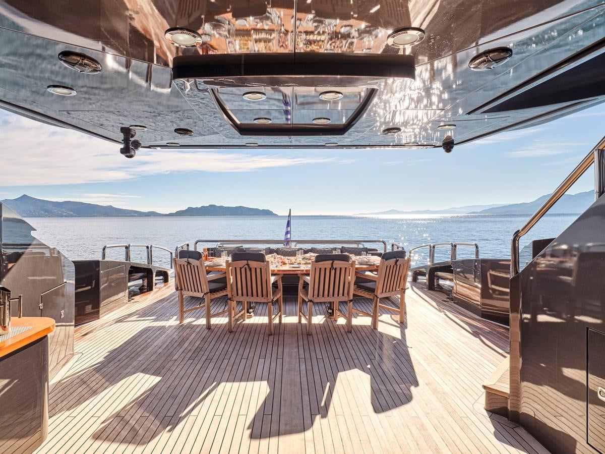a room with a table and chairs aboard O'PATI Yacht for Sale