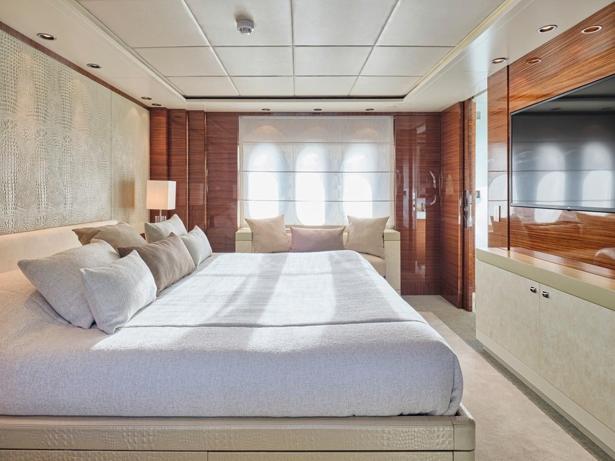 a large bed in a room aboard O'PATI Yacht for Sale