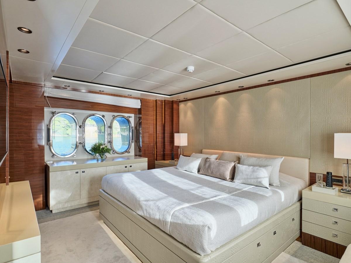 a bedroom with a large mirror aboard O'PATI Yacht for Sale