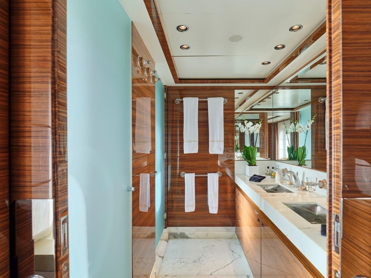 a bathroom with a large mirror aboard O'PATI Yacht for Sale