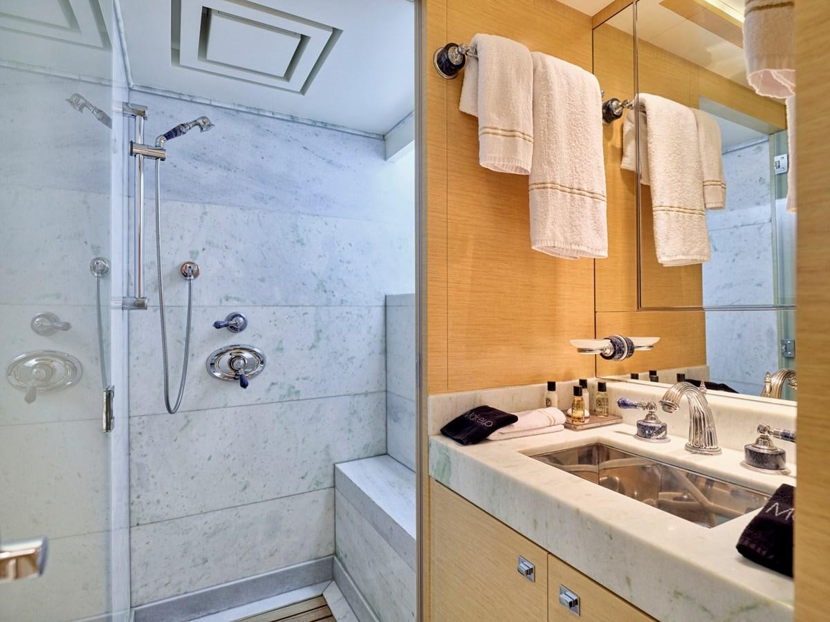 a bathroom with a shower and sink aboard O'PATI Yacht for Sale