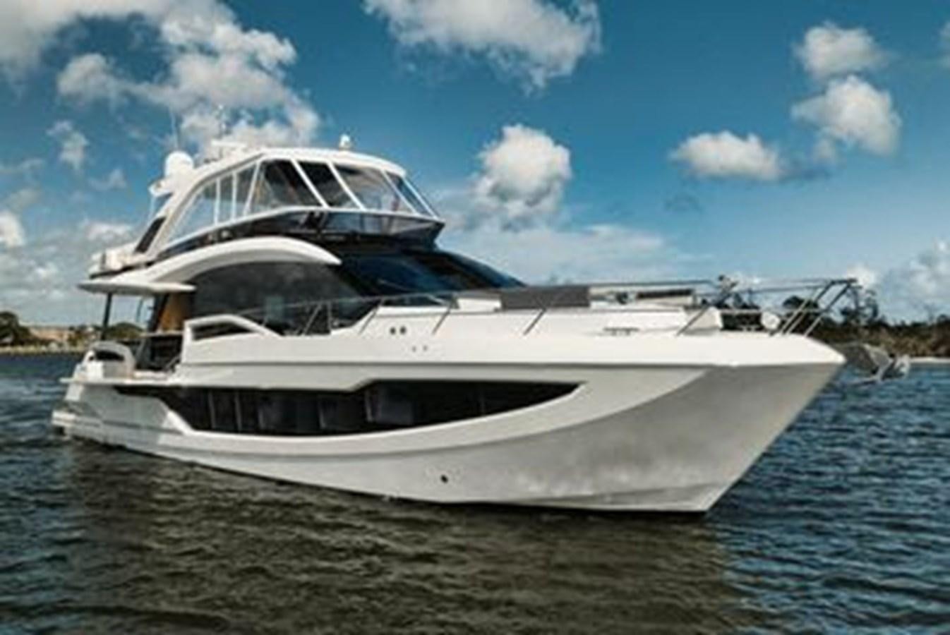 a white yacht on the water aboard JUST IN TIME Yacht for Sale