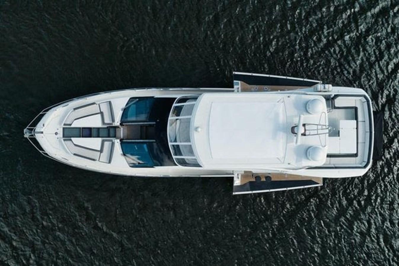 a white car with a door open aboard JUST IN TIME Yacht for Sale