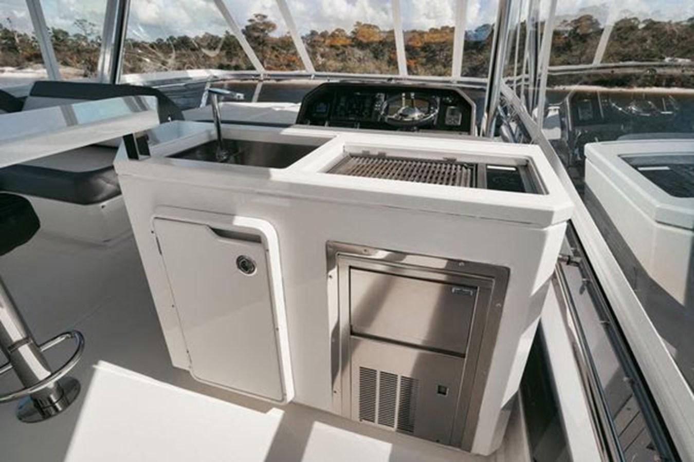 a car with a sink and a washer in the back aboard JUST IN TIME Yacht for Sale