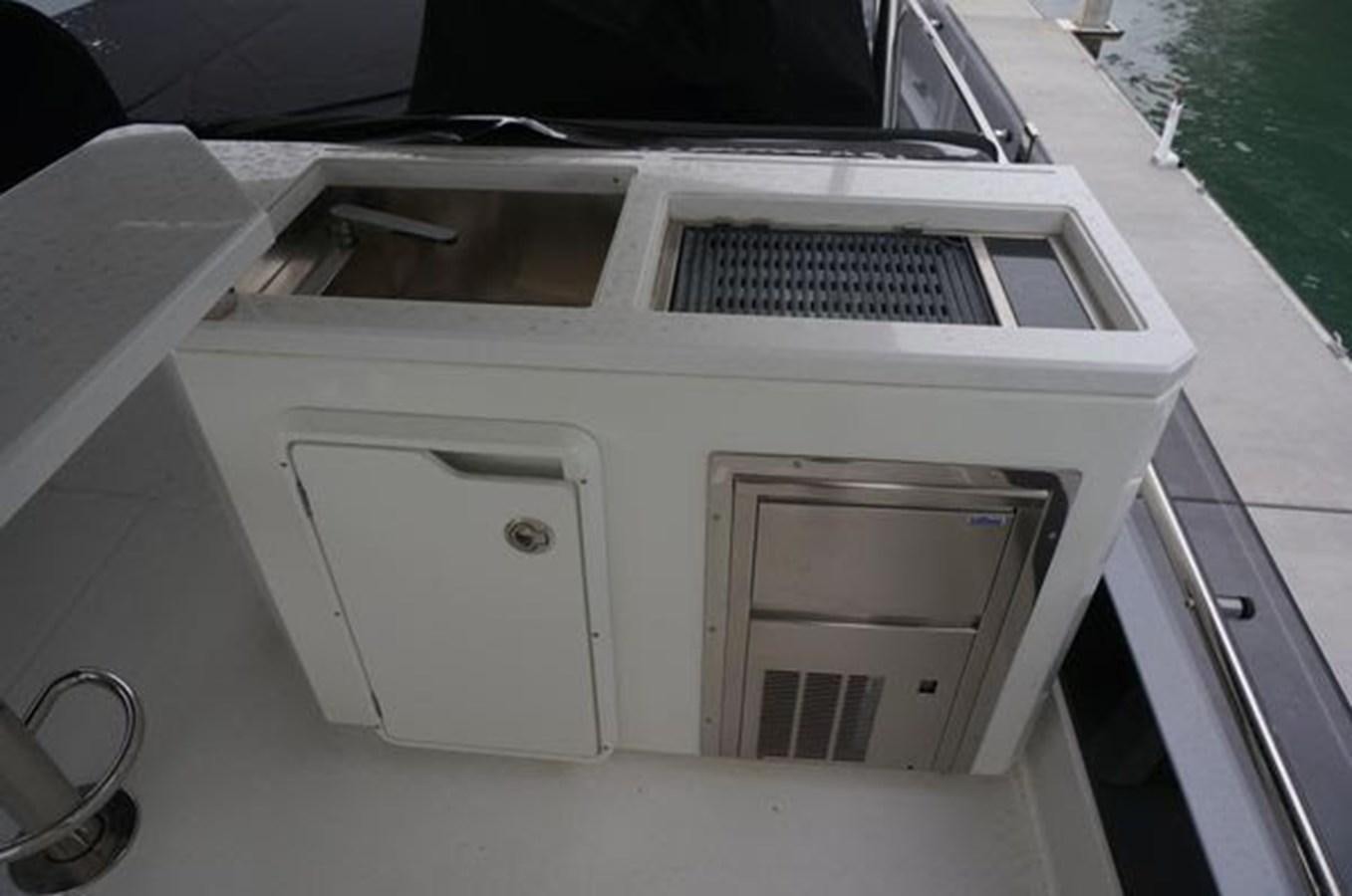 a white car with a door open aboard JUST IN TIME Yacht for Sale