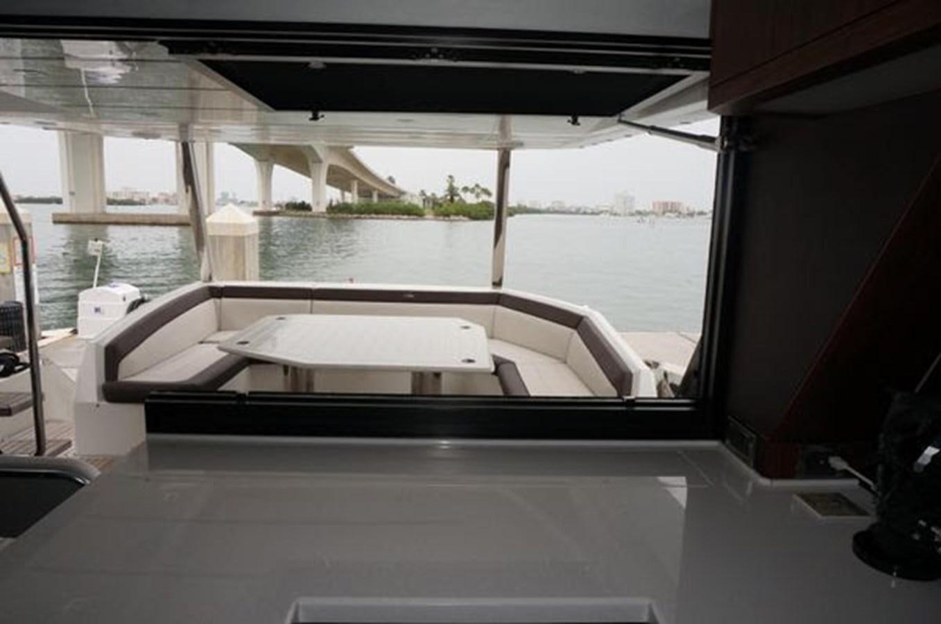a boat on a deck aboard JUST IN TIME Yacht for Sale