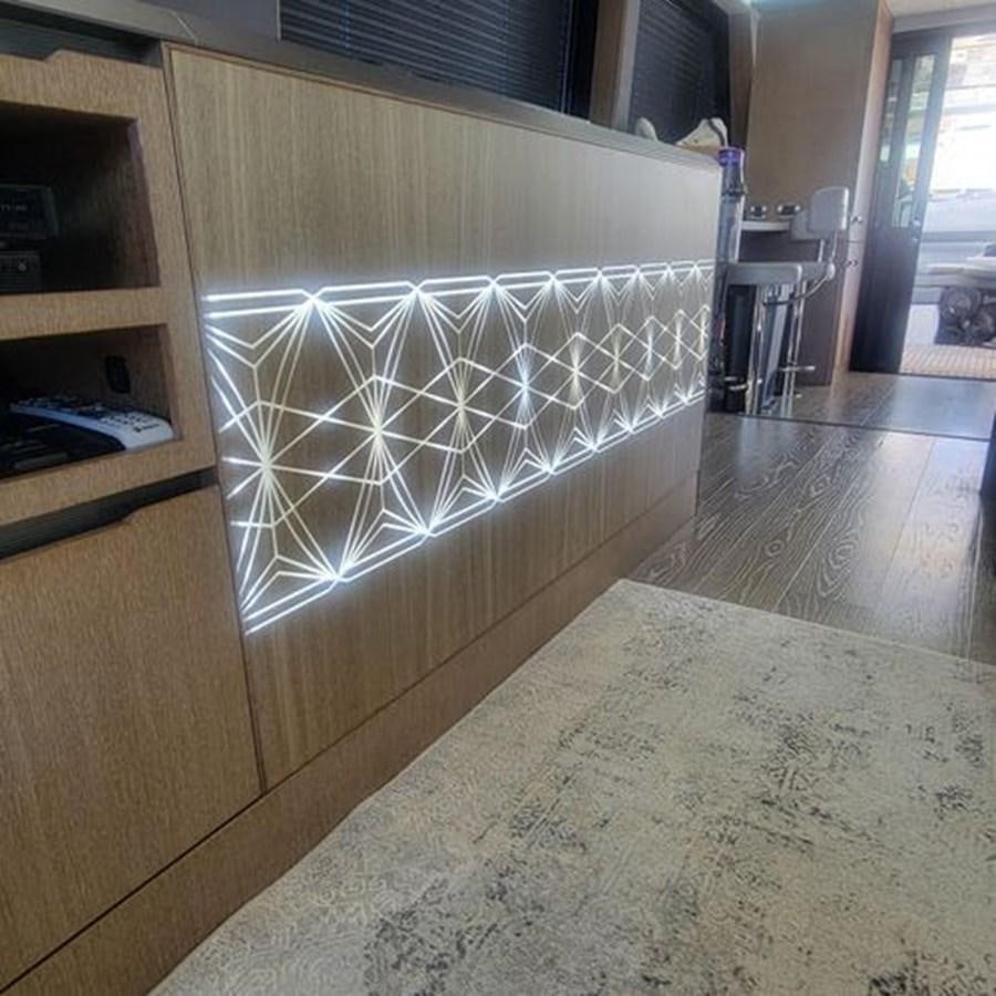 a room with a large glass wall aboard JUST IN TIME Yacht for Sale