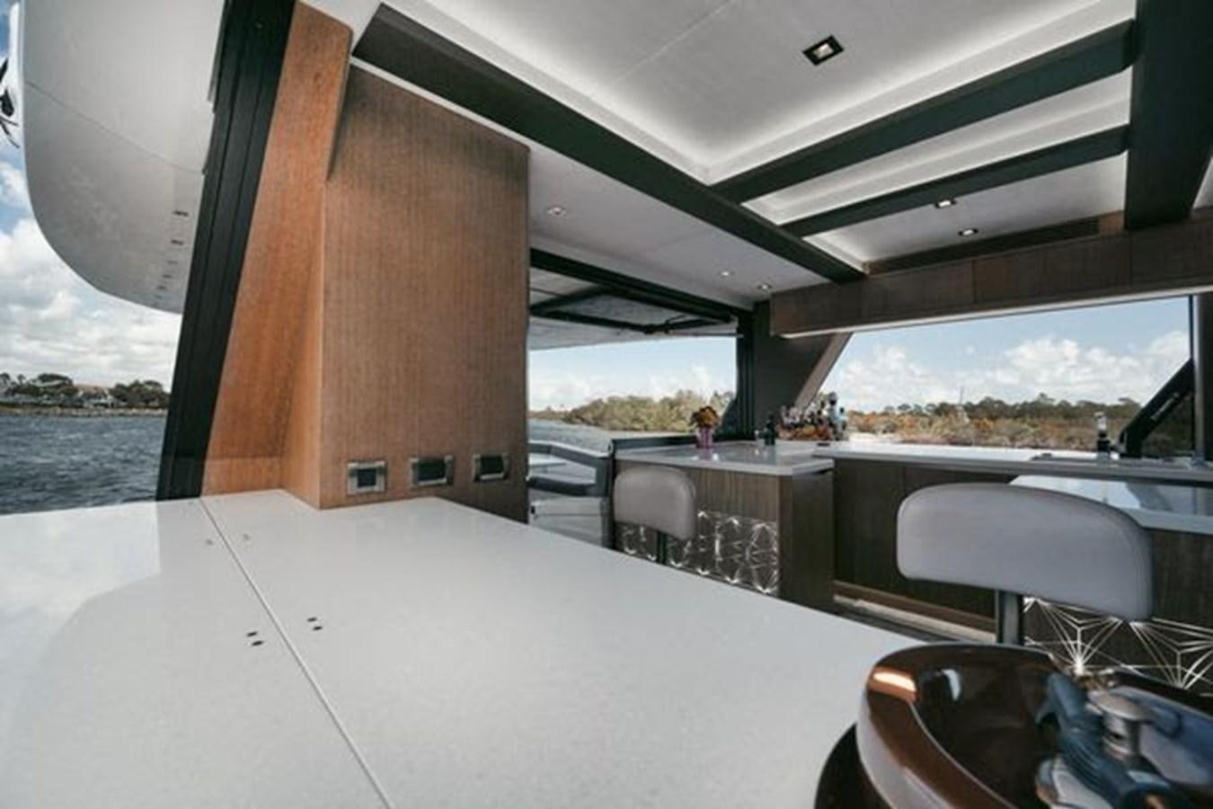 a table with glasses on it aboard JUST IN TIME Yacht for Sale