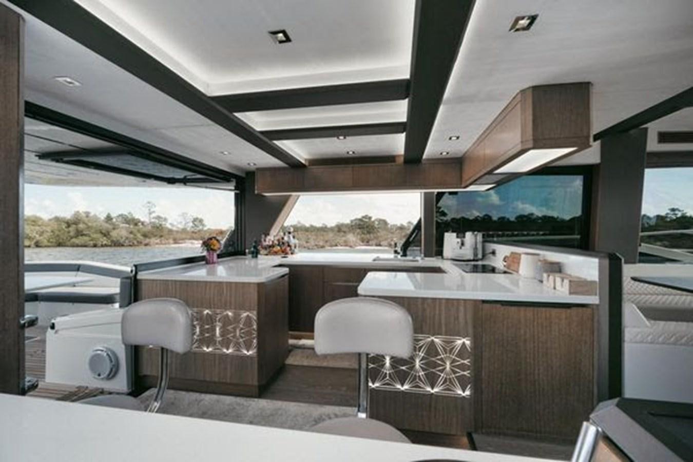 a kitchen with a large window aboard JUST IN TIME Yacht for Sale