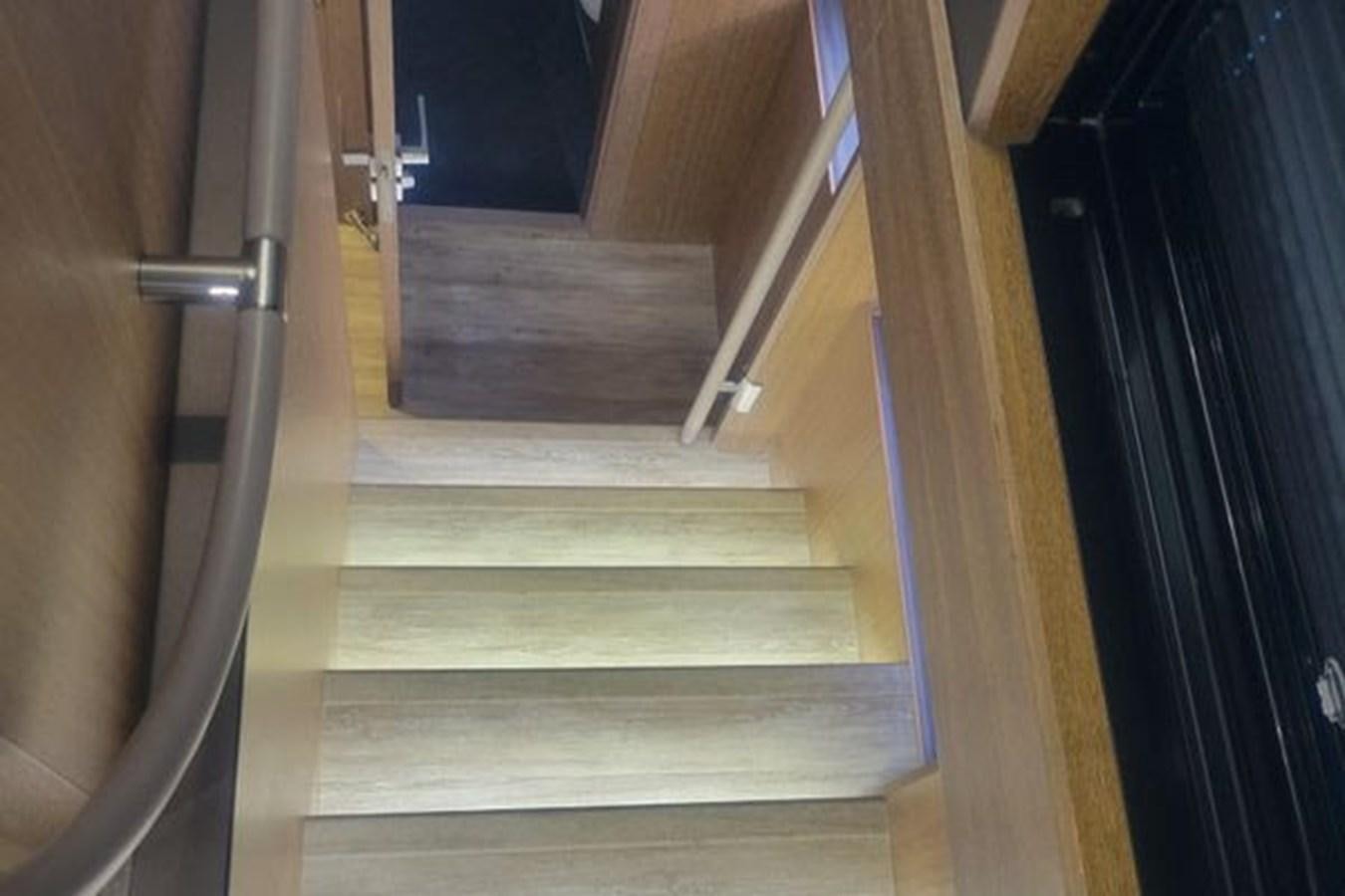 a set of stairs leading to a door aboard JUST IN TIME Yacht for Sale