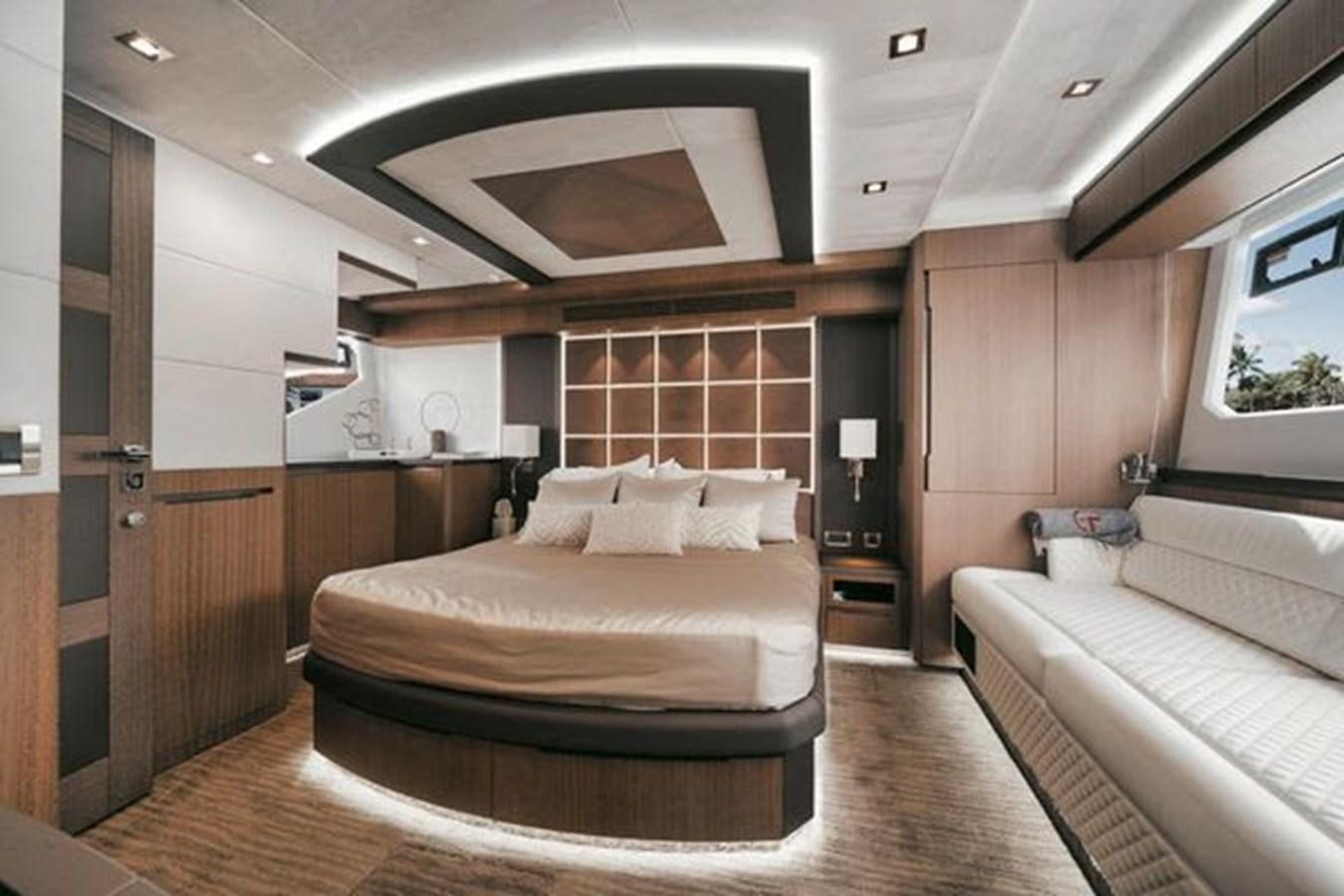 a room with a bed and a window aboard JUST IN TIME Yacht for Sale