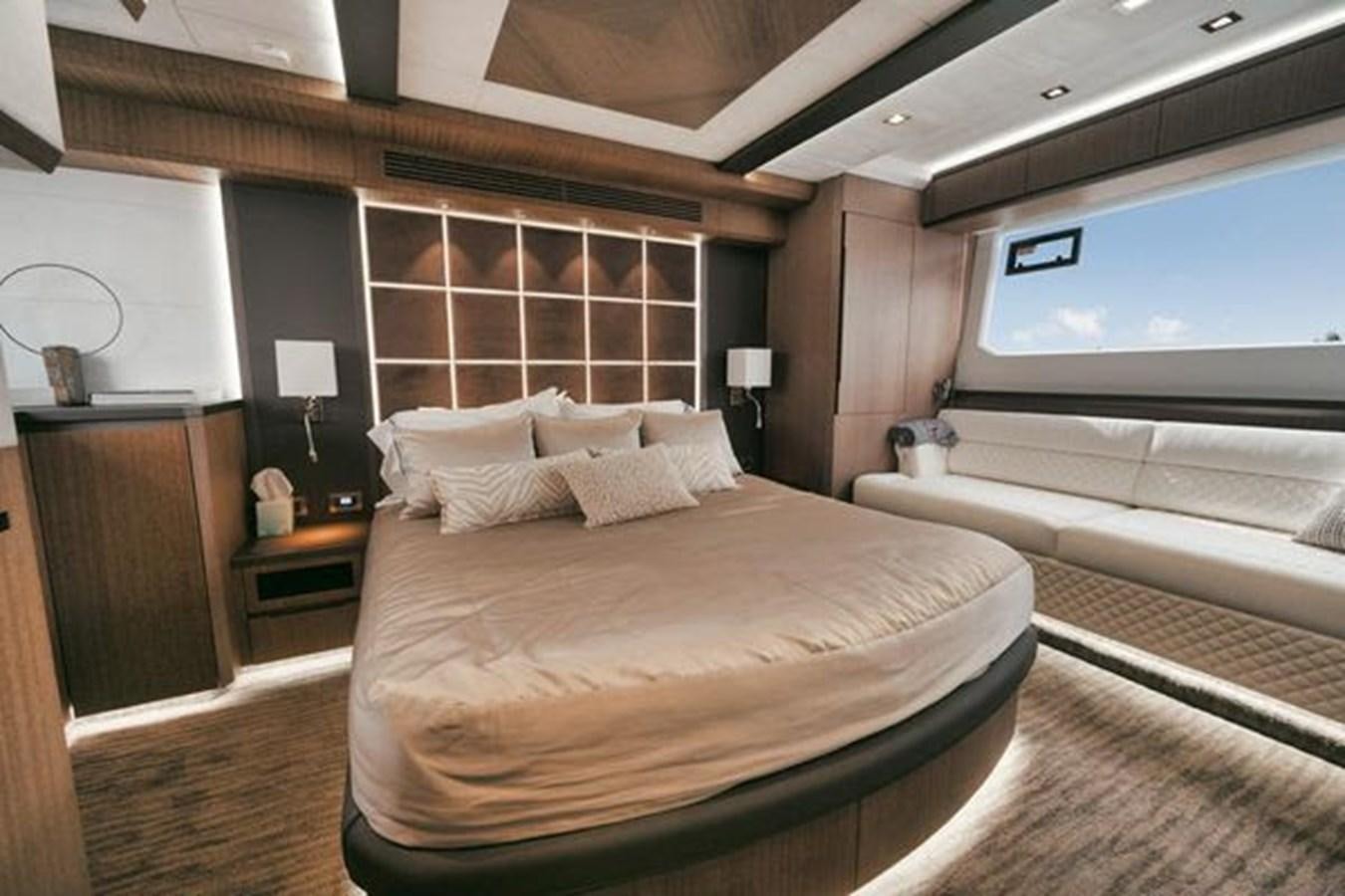 a room with a bed and a window aboard JUST IN TIME Yacht for Sale