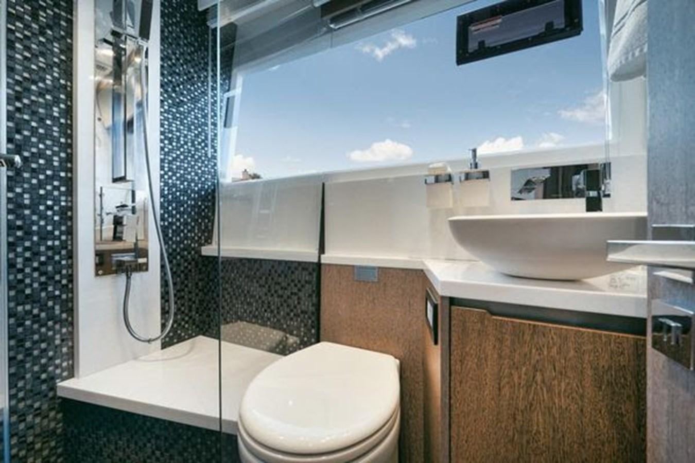 a bathroom with a sink and toilet aboard JUST IN TIME Yacht for Sale