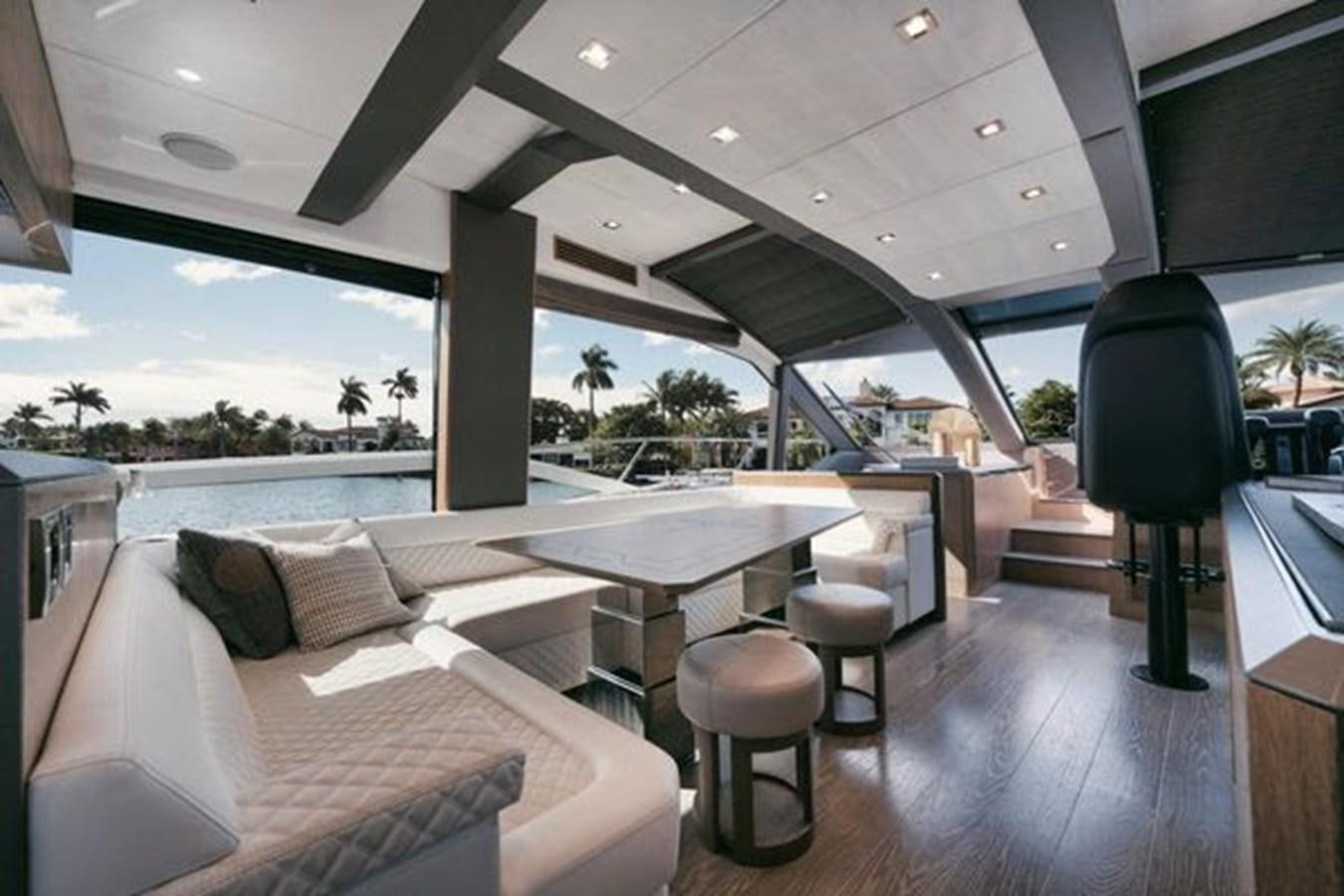 a room with a table and chairs aboard JUST IN TIME Yacht for Sale