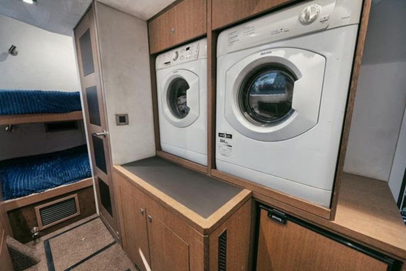 a washer and dryer in a room aboard JUST IN TIME Yacht for Sale