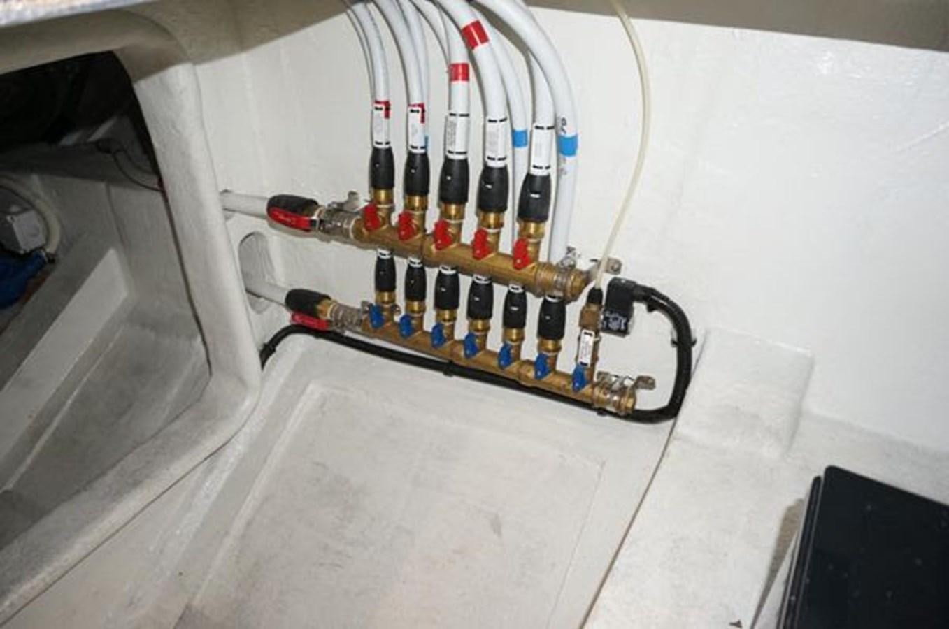 a machine with a lot of bottles in it aboard JUST IN TIME Yacht for Sale