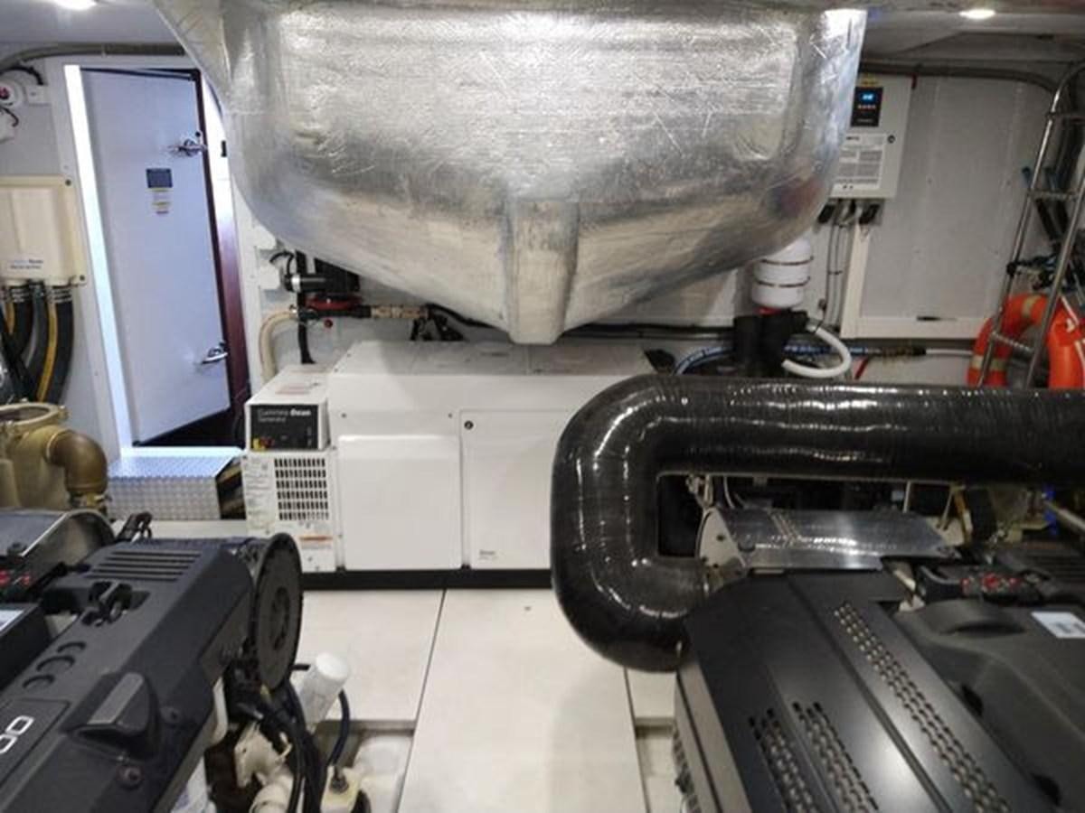 a large machine with a large metal cylinder aboard JUST IN TIME Yacht for Sale