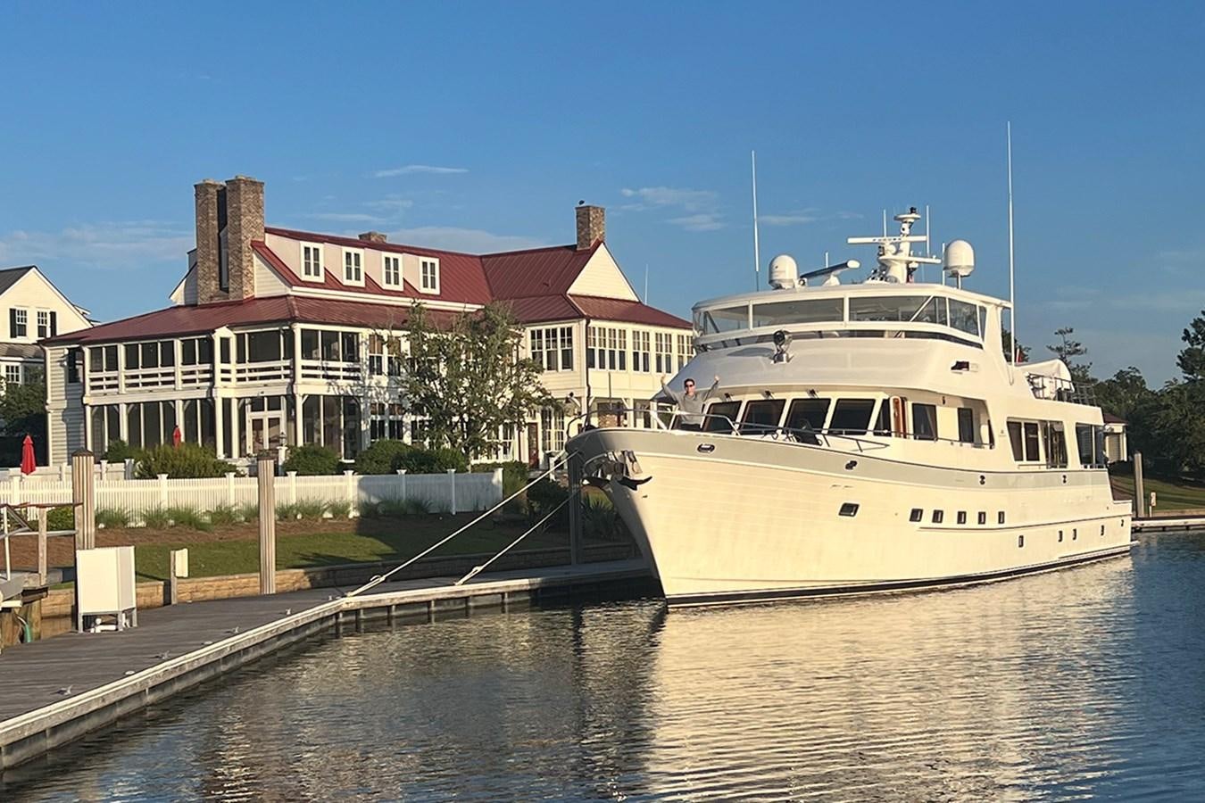 a large white boat docked at a pier aboard 44 NORTH Yacht for Sale