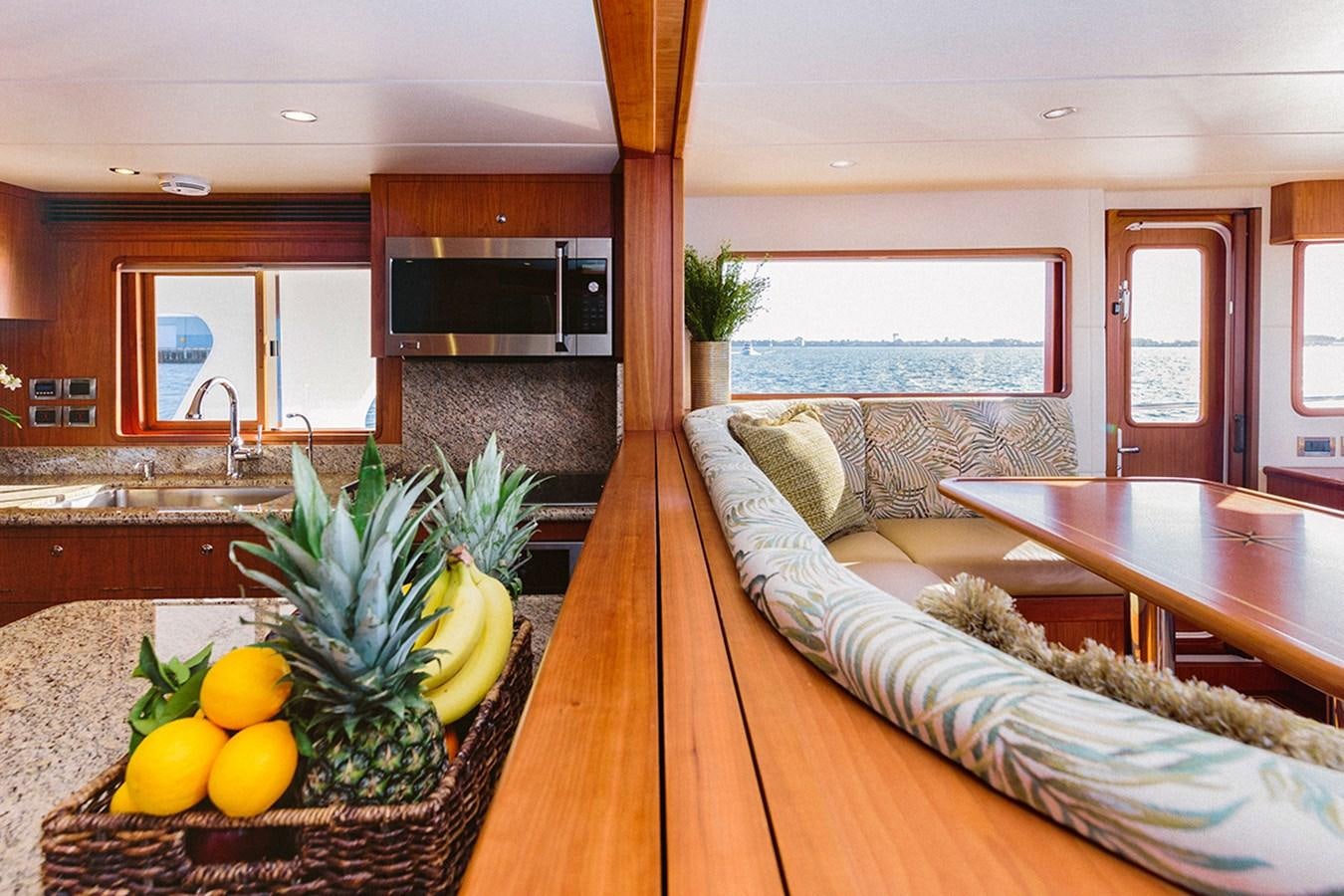 a living room with a couch and a table aboard 44 NORTH Yacht for Sale